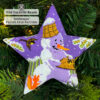 beaded star ornament with a kind snowman feeding birds hanging on a Christmas tree