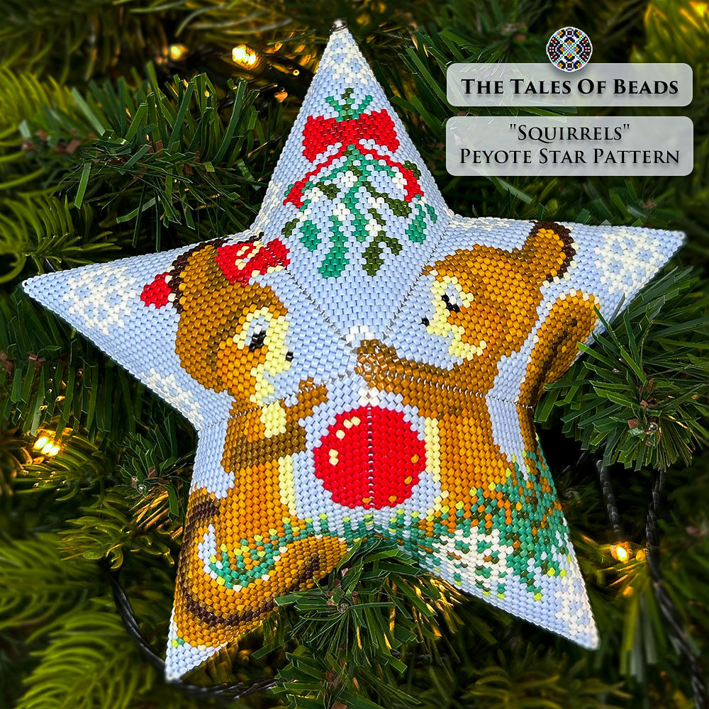 beaded star ornament with a couple of squirrels under a mistletoe hanging on a Christmas tree
