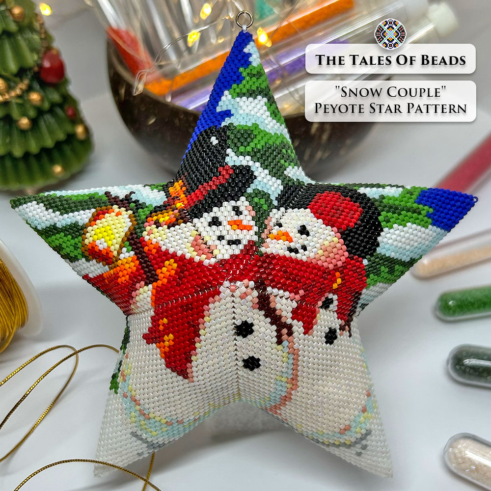 Flat lay of the finished Snow Couple Peyote Star surrounded by craft supplies and Christmas decor