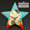 Maneki-Neko beaded star ornament on black background