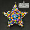 Circus beaded star ornament on black background