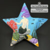 Mermaid beaded star ornament on black background