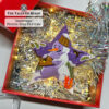 Beaded Christmas star ornament with a snowman displayed in a gift box