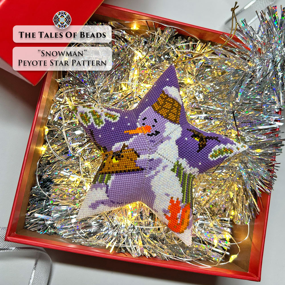 Beaded Christmas star ornament with a snowman displayed in a gift box