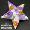 Snowman beaded star ornament on black background