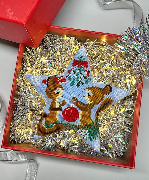 Beaded Christmas star ornament with squirrels family displayed in a gift box