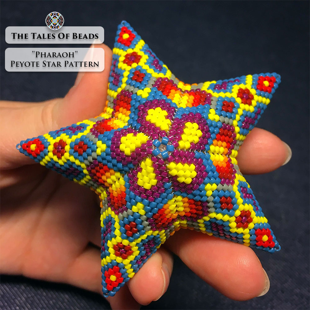 The Pharaoh beaded star ornament held in hand
