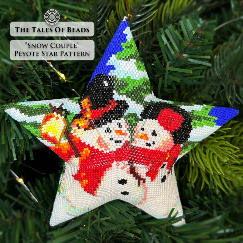 beaded star ornament with a winter scene featuring a couple of snowmen hanging on a Christmas tree