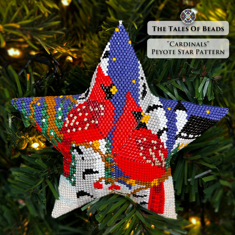 beaded star ornament with a couple of red cardinals perched on branches in front of a church hanging on a Christmas tree