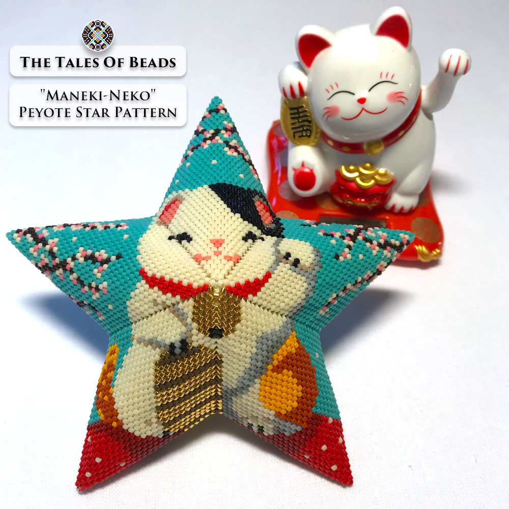 Beaded star ornament featuring a lucky cat with an actual Maneki-Neko figurine in the background