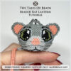 A picture of the Beaded Rat held on hand to show size scale