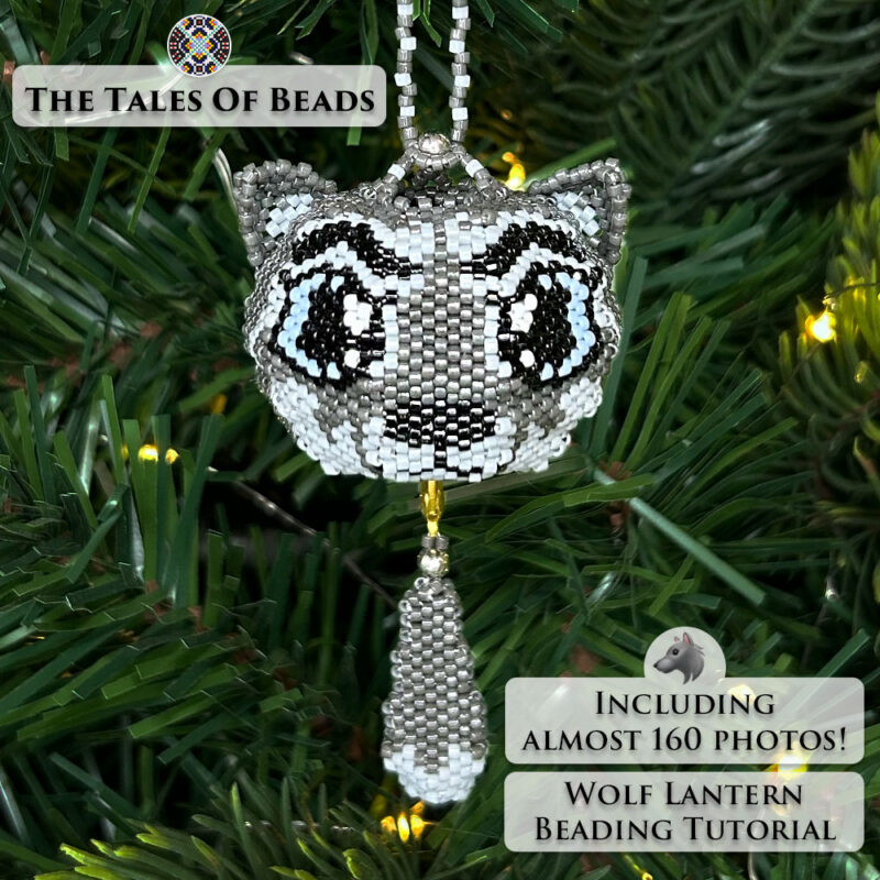 Beaded wolf ornament hanging on a Christmas tree