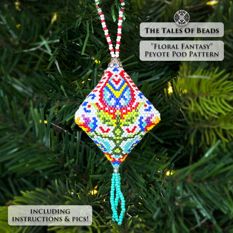 Close-up of the beaded pod ornament with a folk floral motif on a white background displayed on a Christmas tree