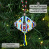 Close-up of a peyote pod ornament with a geometric motif on a Christmas tree