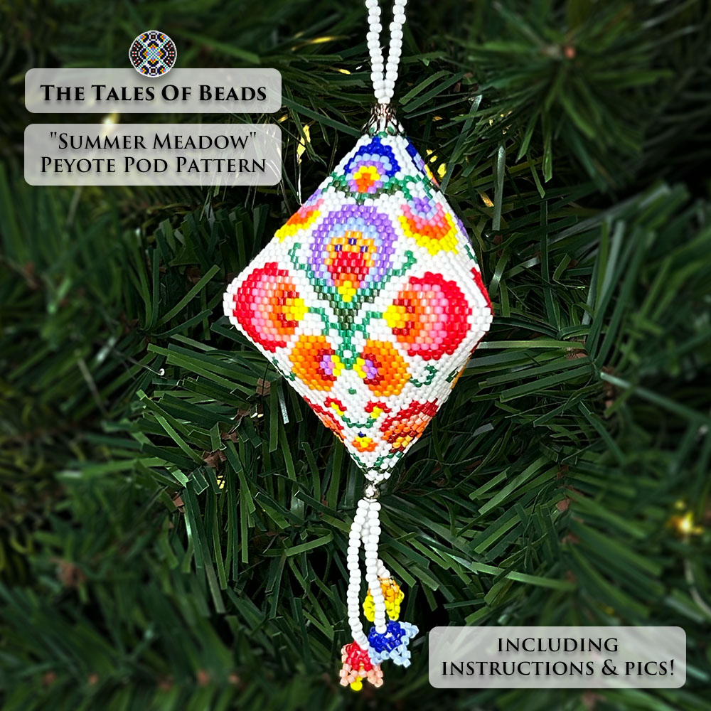 Close-up of the beaded pod ornament with a folk floral motif on a Christmas tree