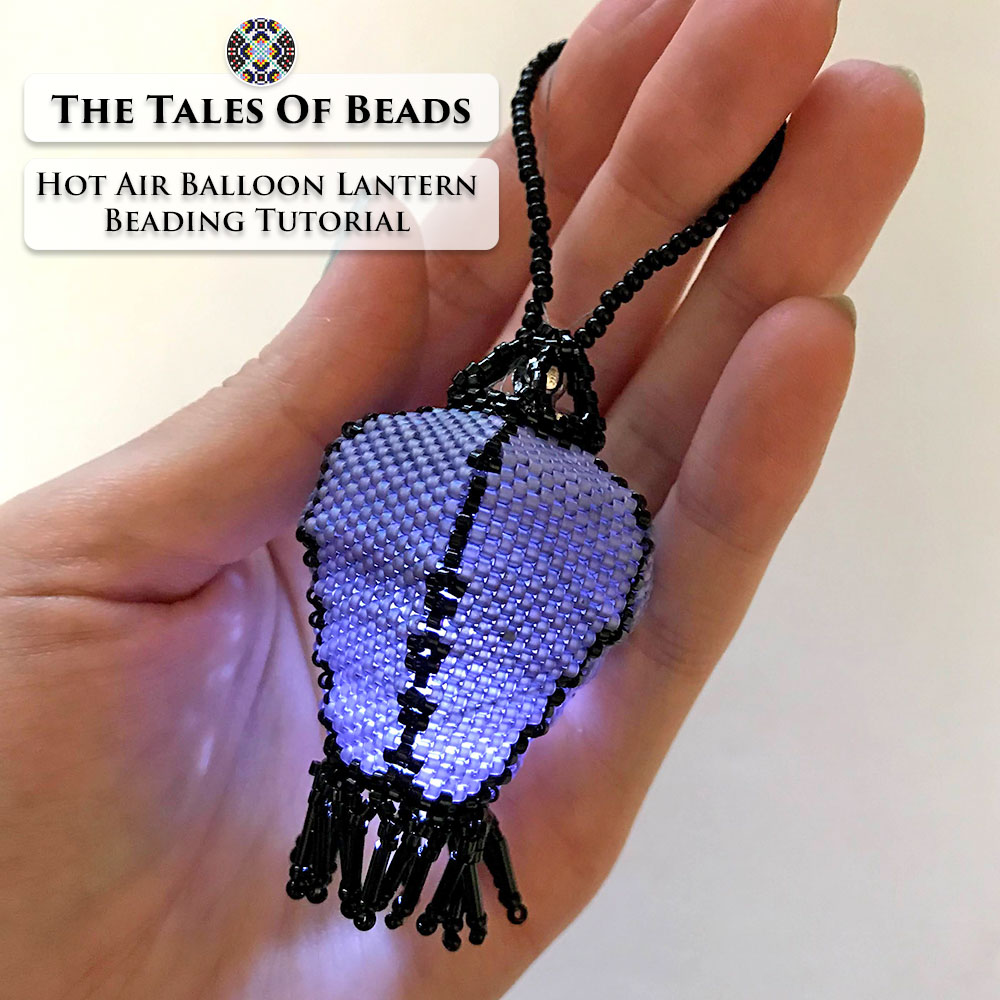 A glowing seed bead lantern with a mini LED light held in hand