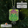 Beaded lantern with art nouveau floral motif displayed on a Christmas tree