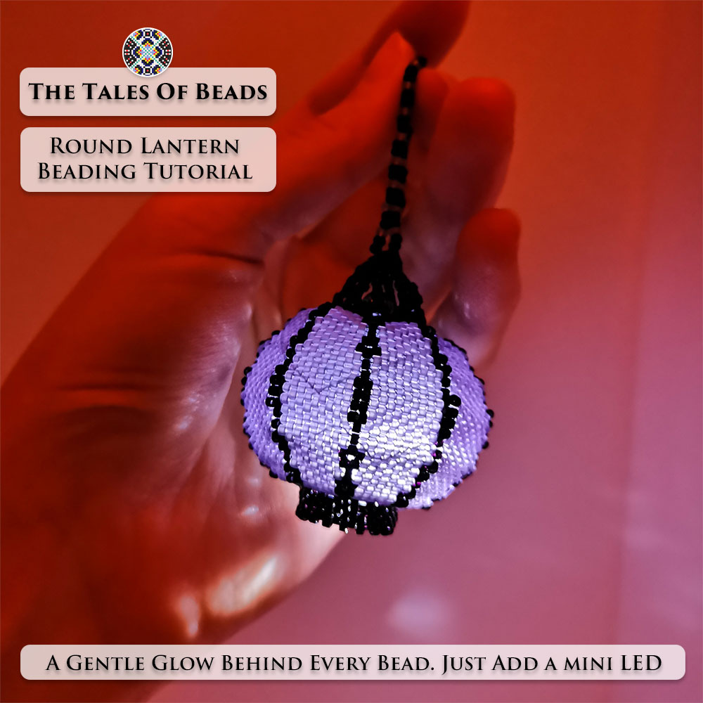 A glowing round seed bead lantern with a mini LED light held in hand