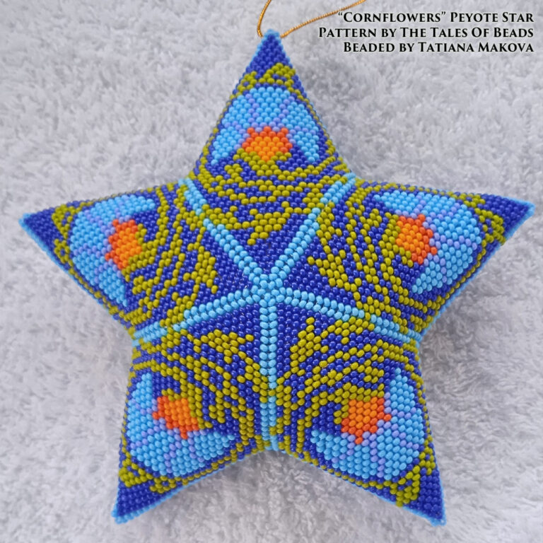A peyote star featuring a floral motif in shades of blue