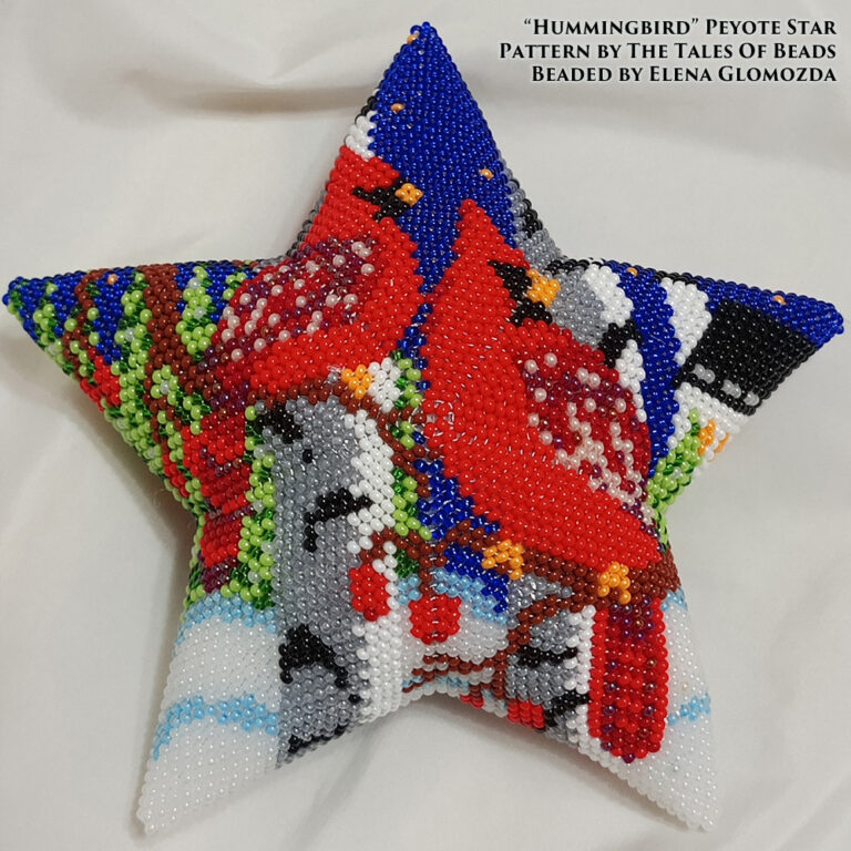 A peyote star featuring a pair of cardinals