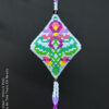 A peyote pod with an elegant botanic motif showcased on black background