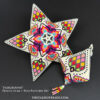 A set of matching peyote stitch ornaments with a striking geometric design showcased on black background