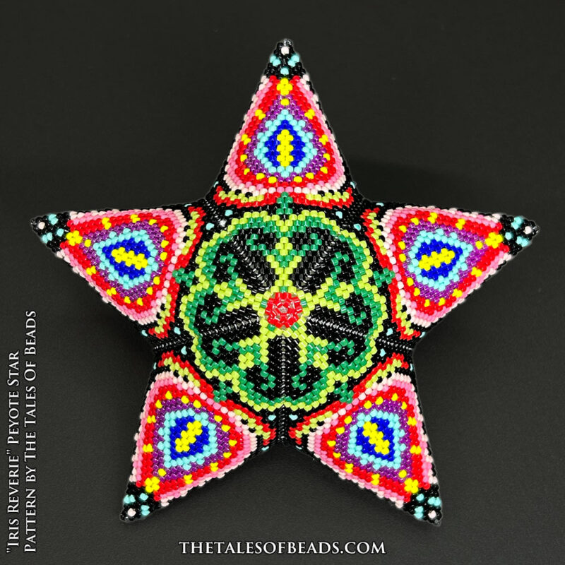 Beaded star ornament with a floral motif showcased on black background