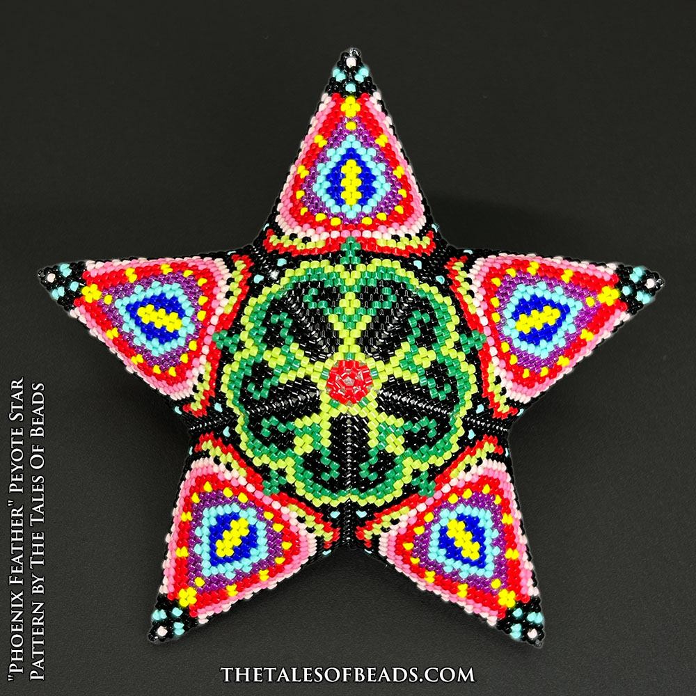 Beaded star ornament with a floral motif showcased on black background