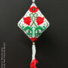 A peyote pod with an elegant poppy motif showcased on black background