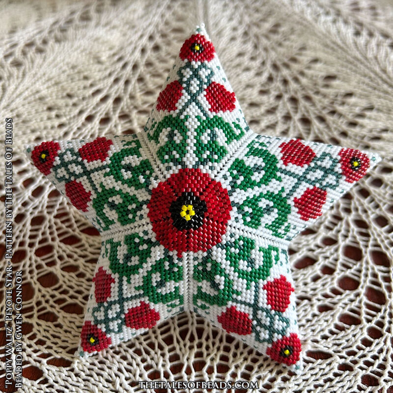 peyote-star-with-floral-motif Peyote star with entwined poppies design showcased on a lace tablecloth